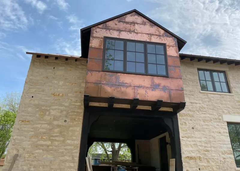 Copper metal panel facade on a stone building for Skylight Installation in Burr Ridge